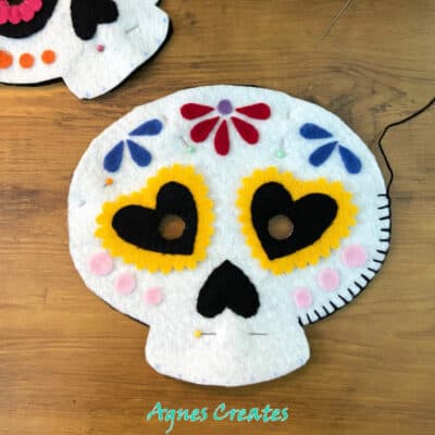 Learn how to make a sugar skull mask! Free templates included!