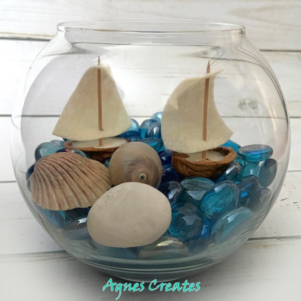 Learn how to diy walnut shell sailboat! It makes a perfect diy summer decor idea! 