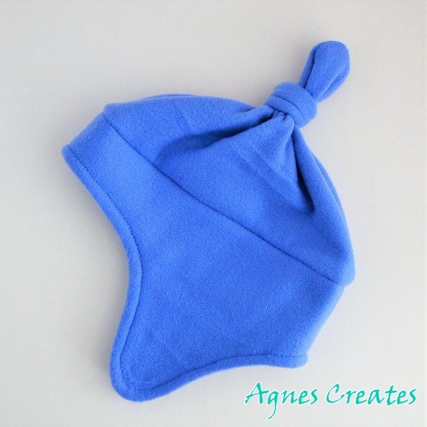 Get my fleece ice skating accessories sewing pattern and learn how to sew a fleece hat with flaps!
