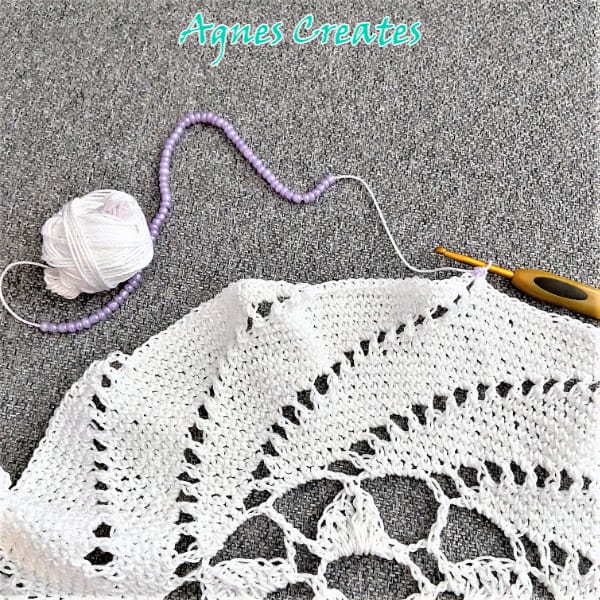 Learn how to crochet a beautiful beaded spiral doily! 